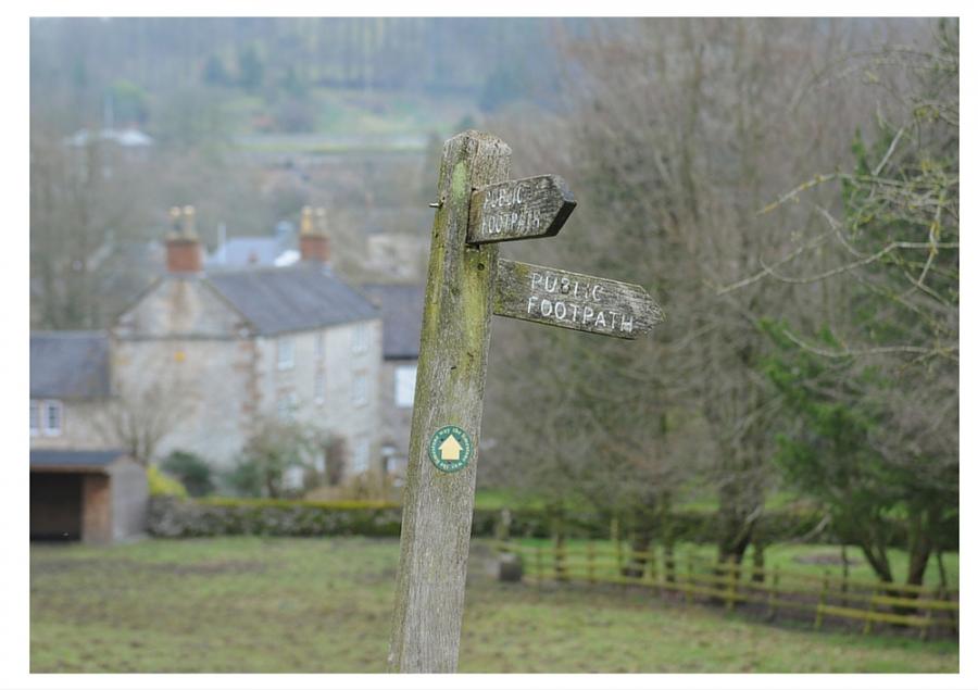 A footpath sign in rural England for an article on the best walks in England and Wales